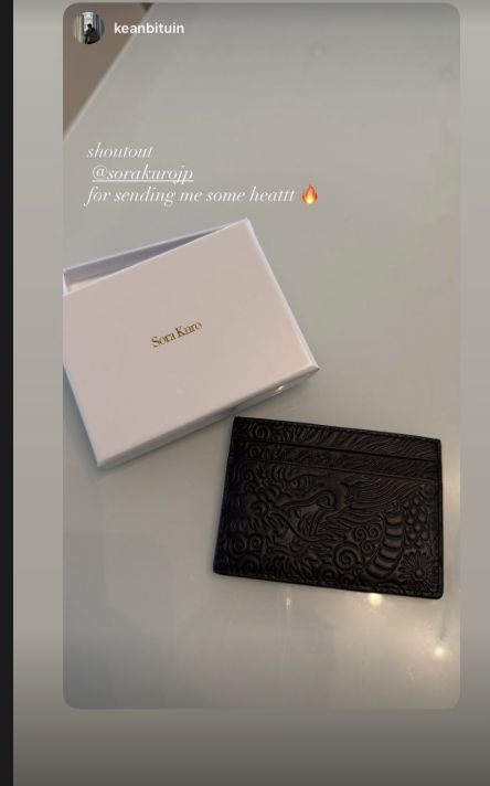 Customer photo of a black Ryu bifold wallet with its box