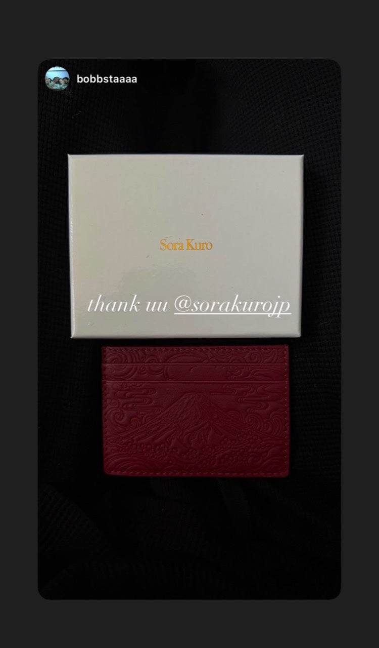 Crimson wallet with Sora Kuro packaging, shared by @bobbstaaaa